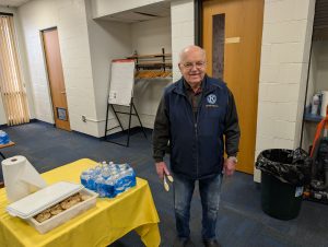 Image of Dean Bauer Standing by the Snack table ready to help anyone get a snack | Kiwanis Club of Bradford